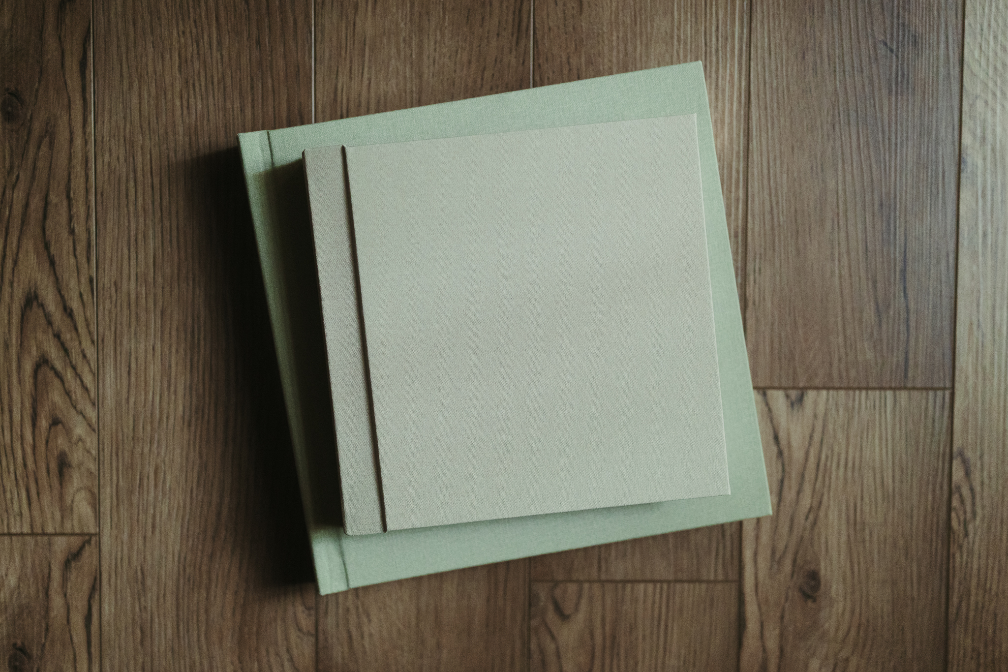 two albums sitting on top of each other